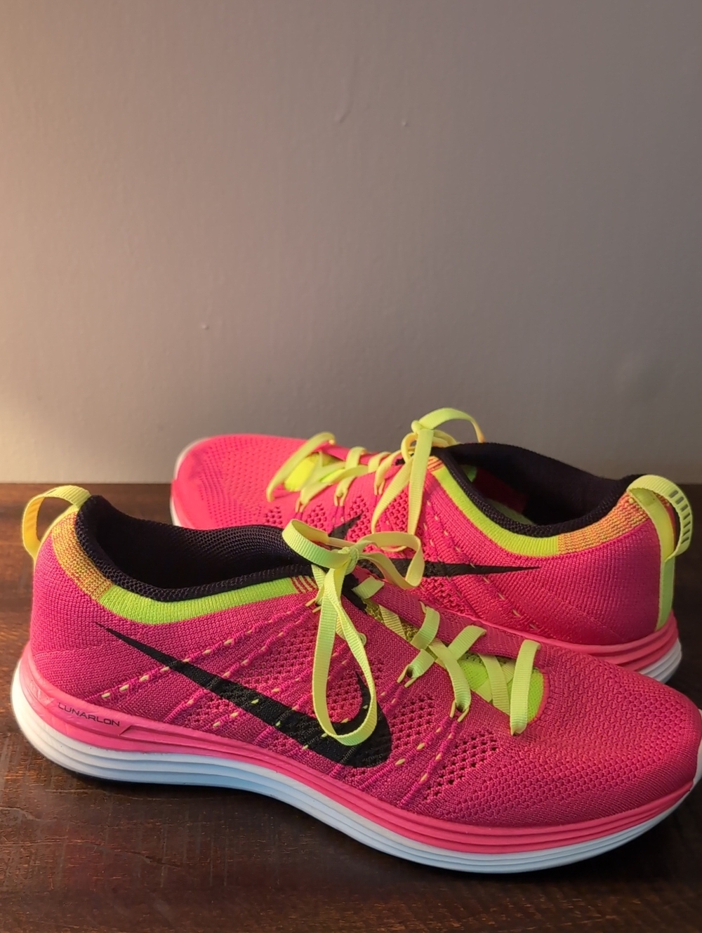 Nike Women’s Pink and Neon Yellow Flyknit Running Shoes